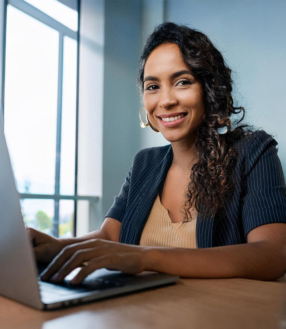 Image depicting a medical billing payer on a laptop at a desk